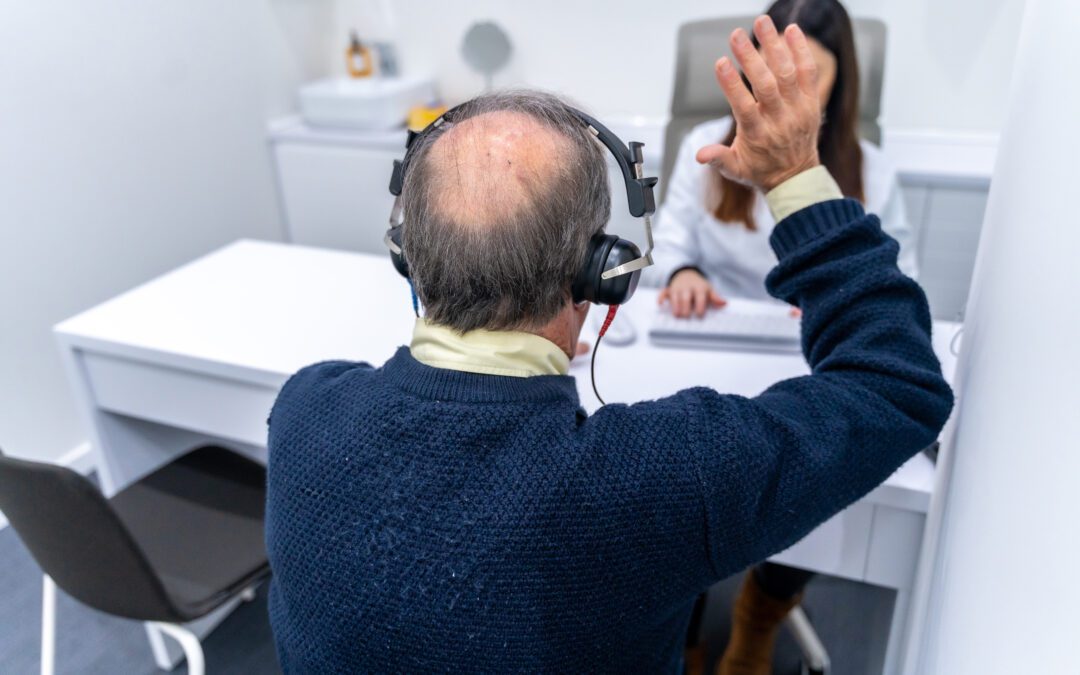 Audiologist explaining hearing test results to a patient in Wenatchee.